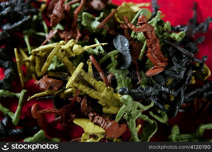 Metaphor of dead plastic toy war soldiers