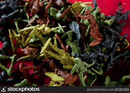 Metaphor of dead plastic toy war soldiers