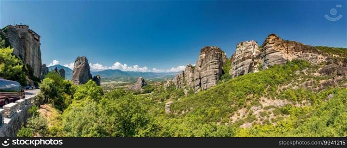 Meteora rocks, Greece. Meteora limestone formations rise from the ground. Cliffs were formed over millions of years by tectonic movements and weathering. Since 11th century, monks have started occupying those almost inaccessible locations and slowly formed monasteries.