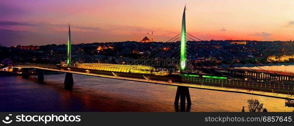 Metro station on Golden Horn bridge in Istanbul at dusk, Turkey