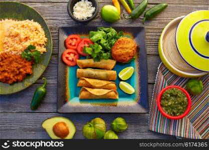 Mexican flautas rolled tacos with salsa and Mexico food ingredients
