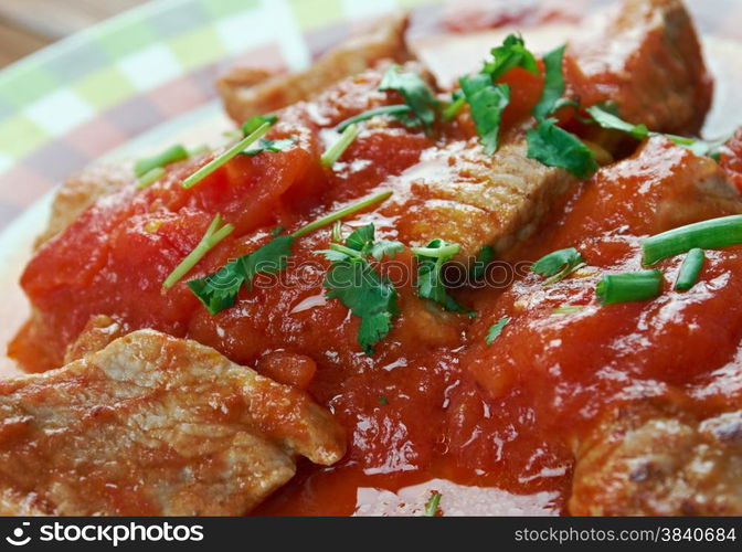 Mexican Grillades and Grits.close up.medallions of various meats