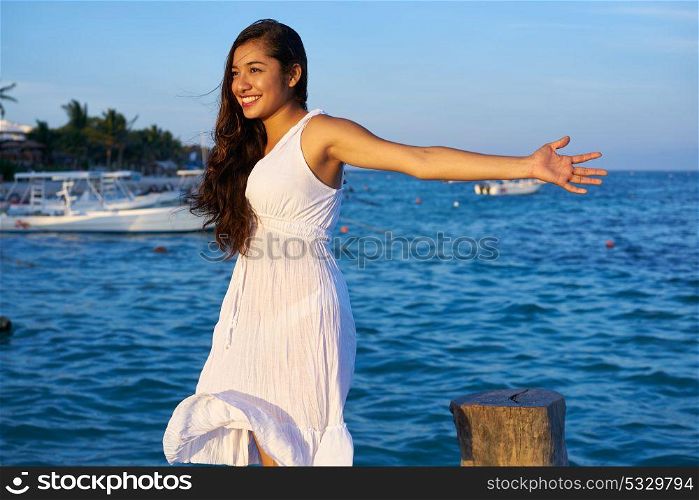 Mexican latin woman happy at Caribbean sea of Riviera Maya in Mexico