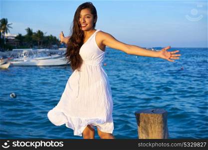 Mexican latin woman happy at Caribbean sea of Riviera Maya in Mexico