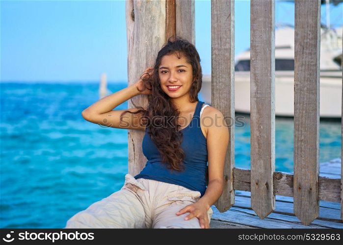 Mexican latin woman relaxed at Caribbean sea of Riviera Maya in Mexico