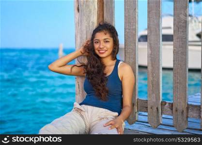 Mexican latin woman relaxed at Caribbean sea of Riviera Maya in Mexico