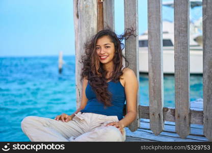 Mexican latin woman relaxed at Caribbean sea of Riviera Maya in Mexico