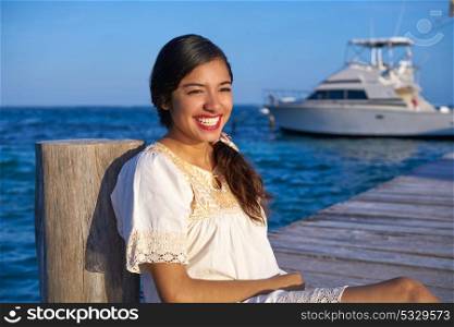 Mexican latin woman with ethnic dress in caribbean sea at Riviera Maya