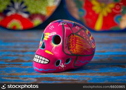 Mexican pink skull dia muertos crafts in Mexico of deaths day