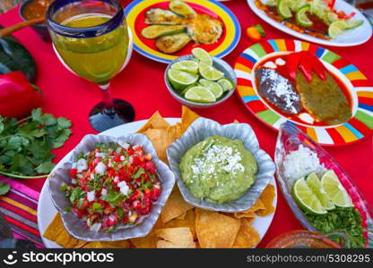 Mexican recipes mix on a colorful table with sauces from Mexico