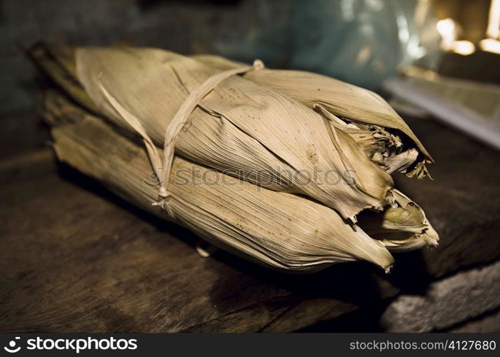 Mexican steamed tamales wrapped in dried corn husks