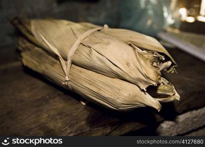 Mexican steamed tamales wrapped in dried corn husks