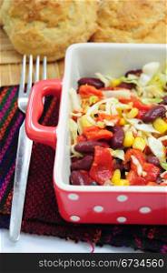 Mexican style salad with red beans, corn, cabbage and red peppers