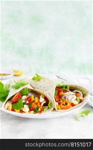 Mexican tacos with chicken meat and vegetables