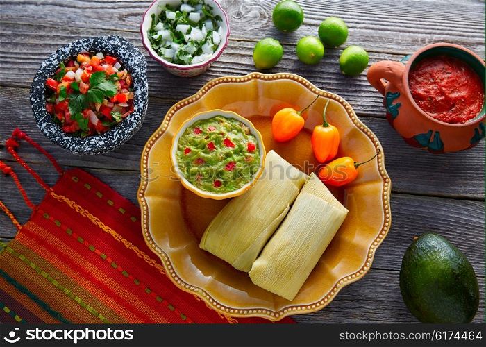 Mexican Tamale tamales of corn leaves with chili and sauces