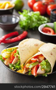 mexican tortilla wrap with chicken breast and vegetables