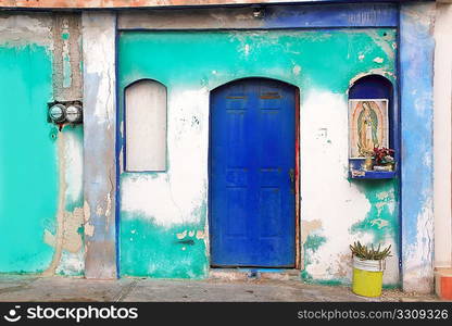 Mexican virgin madonna figure house facade tropical Caribbean Guadalupe