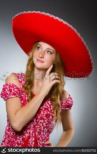 Mexican woman wearing red sombrero