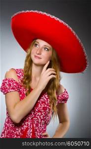 Mexican woman wearing red sombrero