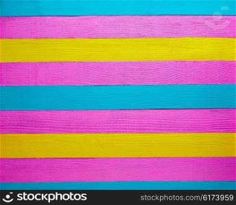 Mexican wood background colorful pink yellow and turquoise