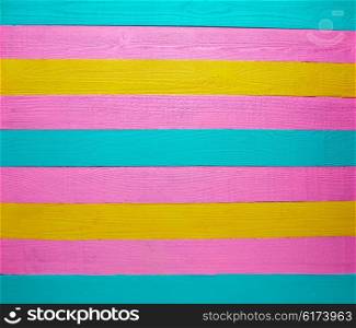 Mexican wood background colorful pink yellow and turquoise