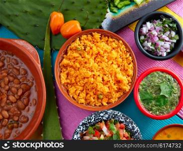 Mexican yellow rice with chilis and sauces frijoles beans