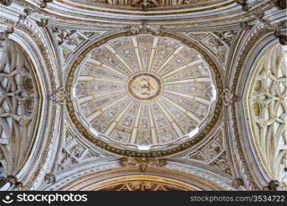 Mezquita Cathedral main chapel ornate crossing dome ceiling of the transept in Cordoba, Spain.