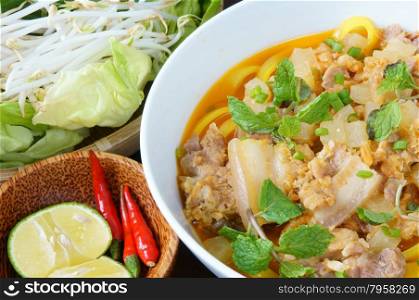 Mi quang and raw material as pork meat, salad, vegetable, chilli, lemon, yellow noodle, dried shrimp, Quang noodle is famous Vietnamese food, very delicious eating