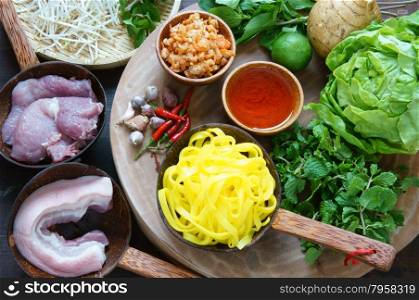 Mi quang and raw material as pork meat, salad, vegetable, chilli, lemon, yellow noodle, dried shrimp, Quang noodle is famous Vietnamese food, very delicious eating