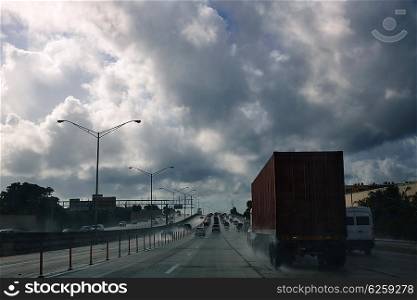 Miami Florida rainy driving road with trucks traffic