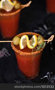 Michelada - Mexican alcoholic cocktail, tomato juice, spicy sauce and spices. Great idea for a Halloween party.