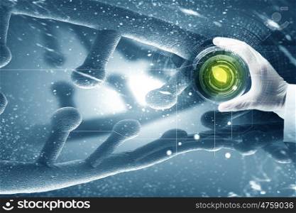 Microbiology concept. Close up of scientist hand holding tube with leaf