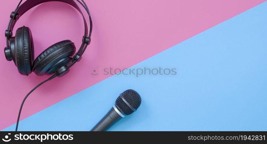 Microphone and headphone on a purple and blue background