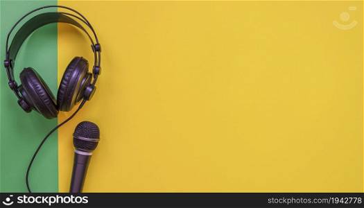 Microphone and headphone on a yellow background
