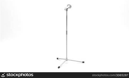 Microphone on metal stand rotates on white background