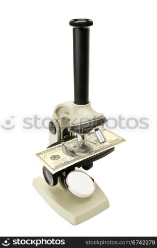 microscope and money isolated on a white