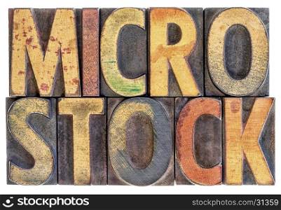 microstock photography concept - isolated word abstract in vintage letterpress wood block type, stained by color ink
