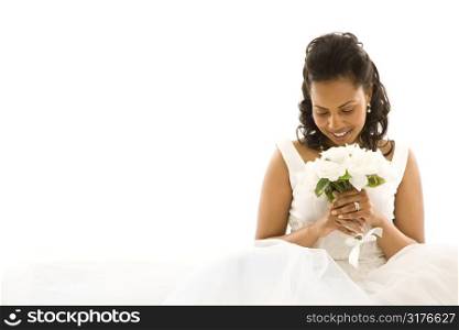 Mid-adult African-American bride on white background.