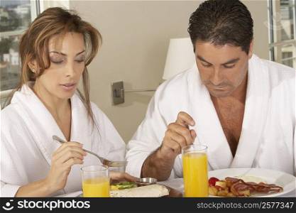 Mid adult couple having breakfast
