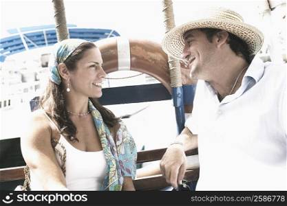 Mid adult couple looking at each other and smiling