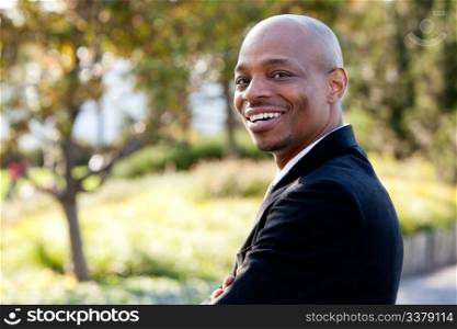 Mid adult male model in outdoor setting. Horizontally framed shot.