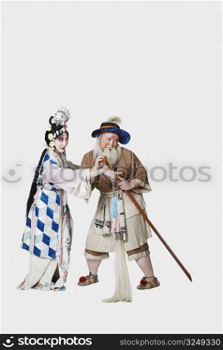 Mid adult man and a mature woman wearing traditional clothing