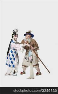 Mid adult man and a mature woman wearing traditional clothing