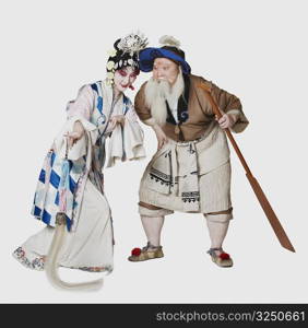 Mid adult man and a mature woman wearing traditional clothing