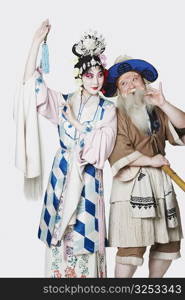 Mid adult man and a mature woman wearing traditional clothing