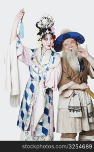 Mid adult man and a mature woman wearing traditional clothing