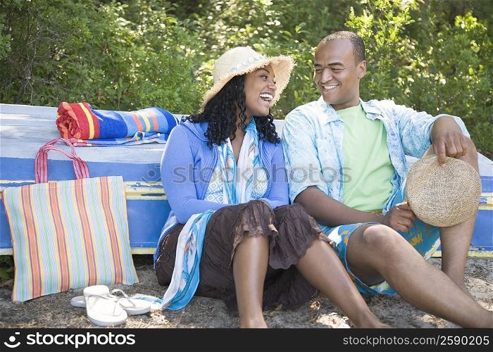 Mid adult man and a young woman sitting together