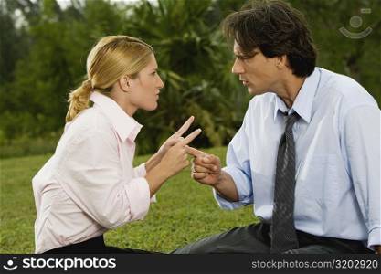 Mid adult man arguing with a young woman