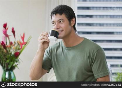 Mid adult man drinking a cup of tea