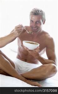 Mid Adult Man Eating A Bowl Of Cereal
